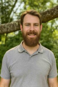 Joshua, an ordained Christian minister serving as a wedding officiant.