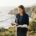 Female Christian wedding officiant in California holding an open Bible and reviewing wedding ceremony notes while preparing for ordained ministry and wedding officiant service.