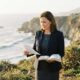 Female Christian wedding officiant in California holding an open Bible and reviewing wedding ceremony notes while preparing for ordained ministry and wedding officiant service.