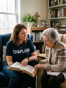 Ministry chaplain reading Bible and talking with church member wearing CHAPLAIN shirt and cross necklace